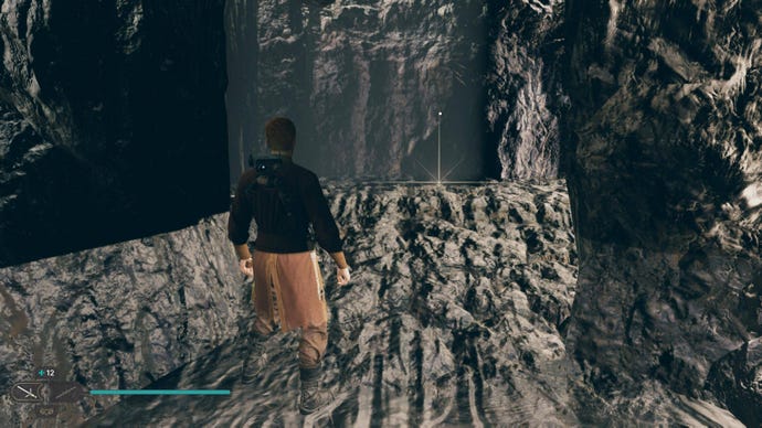 Cal approaches a Priorite Shard on the ground in a cave in Jedi: Survivor.